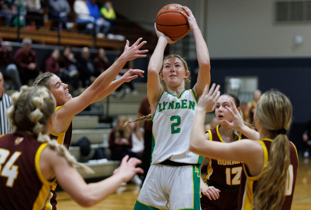 Lynden’s Lexie Hermanutz puts up a shot surrounded by White River defenders.