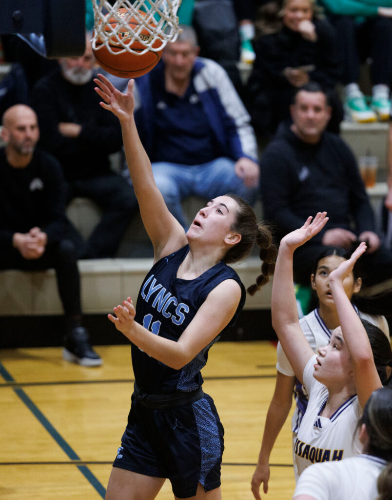 Lynden Christian’s Estela Hernandez scores a layup shot against Issaquah.