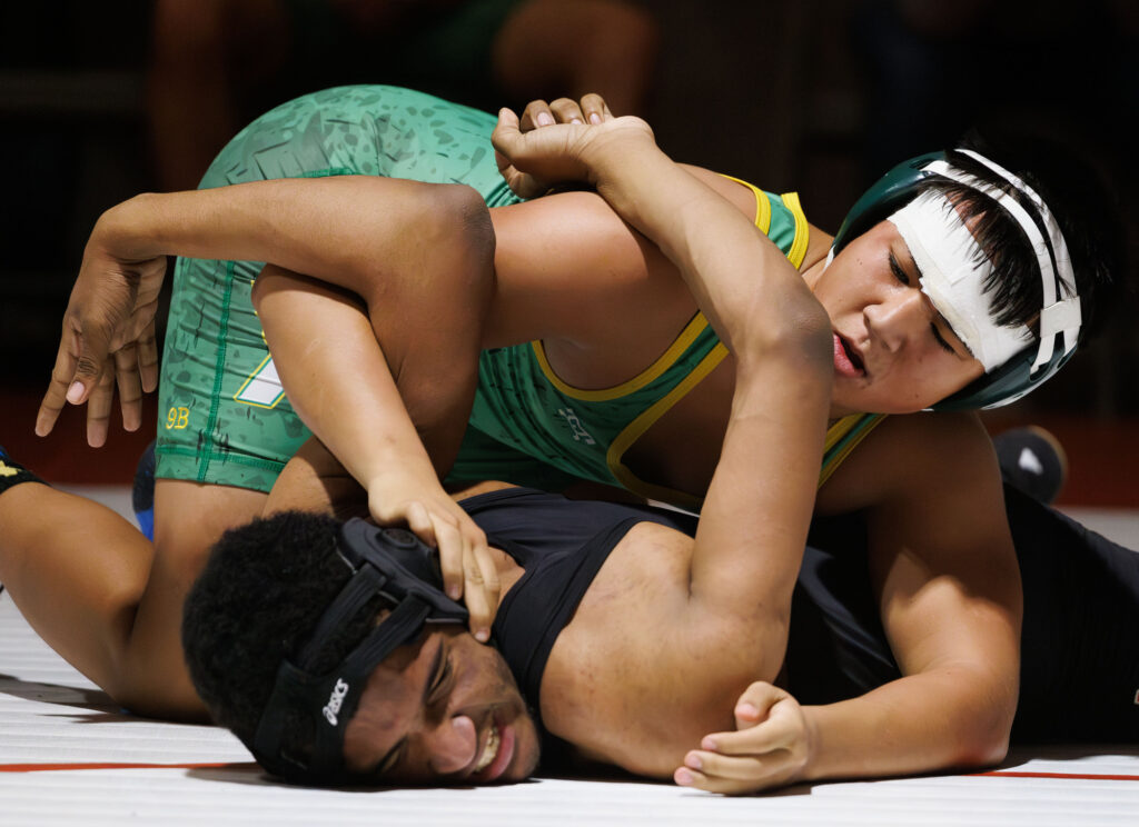 Mount Baker's Lakai Fairbanks gets twisted up by Lynden's Miguel Lopez during a double dual with Lynden, Mount Vernon, Mount Baker and Bellingham on Wednesday.