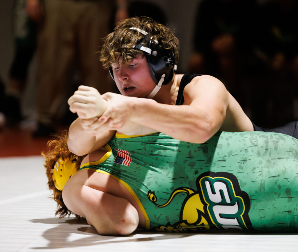 Mount Baker's Dylan Moa pulls on his opponent’s arm to get him on his back during a match at a double dual with Lynden, Mount Vernon, Mount Baker and Bellingham on Wednesday.