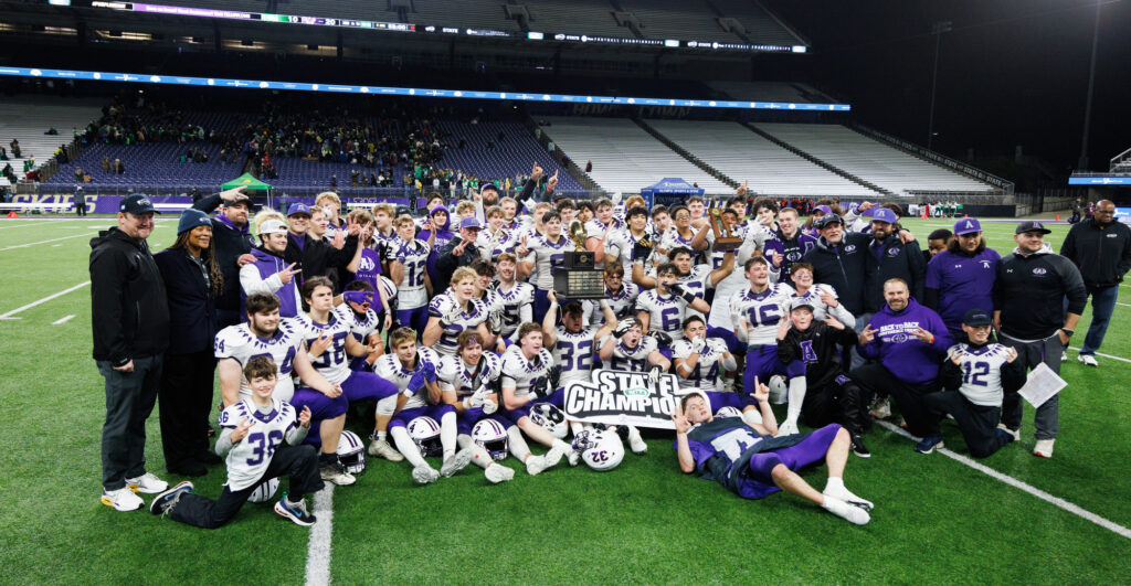 Anacortes celebrates after beating Tumwater 20-10 for its second straight state title.