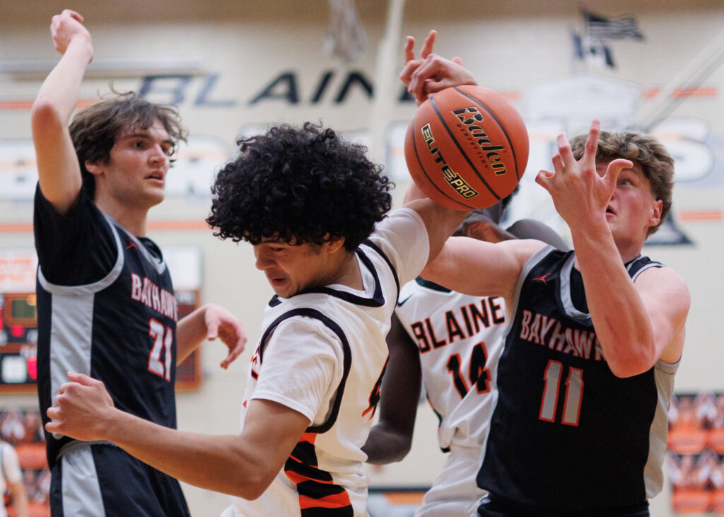 Blaine’s Daniel Banks loses the ball as Bellingham’s Joe Harward tries to grab the rebound.