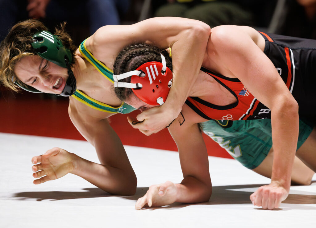 Lynden's Kai Smith pulls on the head of Bellingham's Kaleb Asher during a match at a double dual on Wednesday.