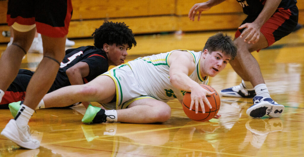 Lynden’s Malachi Koenen falls to the ground while going for a loose ball.