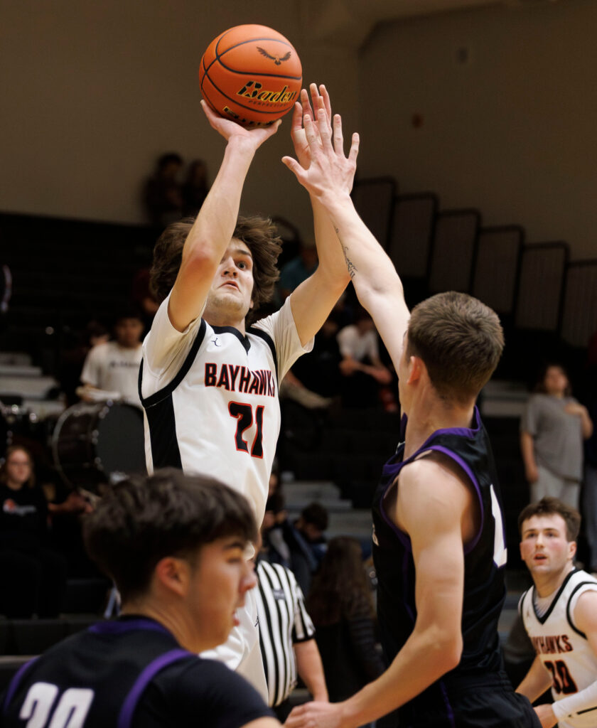 Bellingham’s Kincade Vanhouten hits a three-point shot against Anacortes Dec. 19.