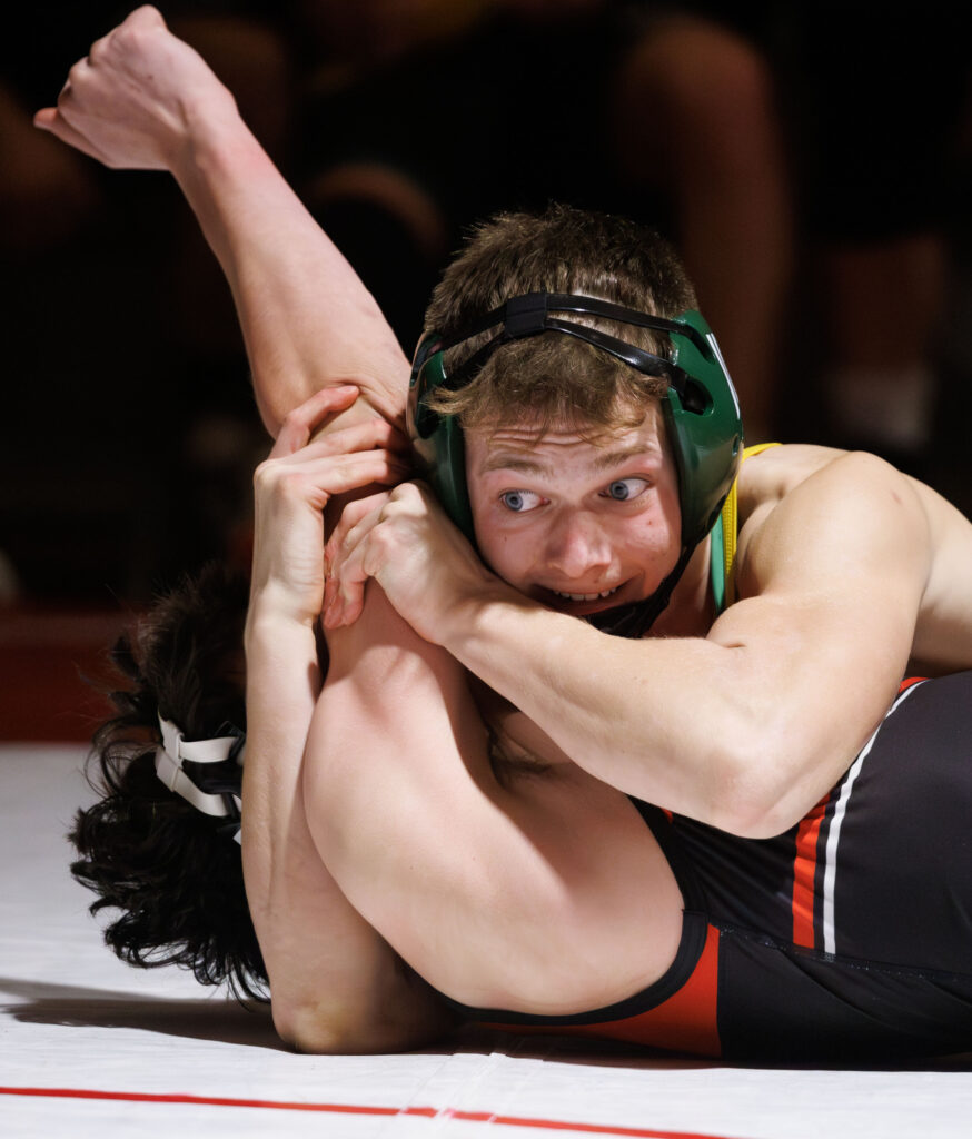 Lynden's Everett Taylor holds on to pin his opponent during a double dual with Lynden, Mount Vernon, Mount Baker and Bellingham on Wednesday.