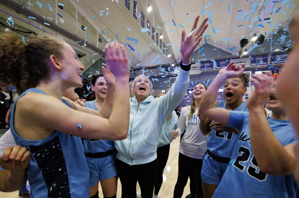 Western women's basketball head coach Carmen Dolfo and her team celebrate Jan. 11 as confetti drops for her 700th career win as the Vikings came from behind to beat Central Washington University 67-65 at Carver Gym.