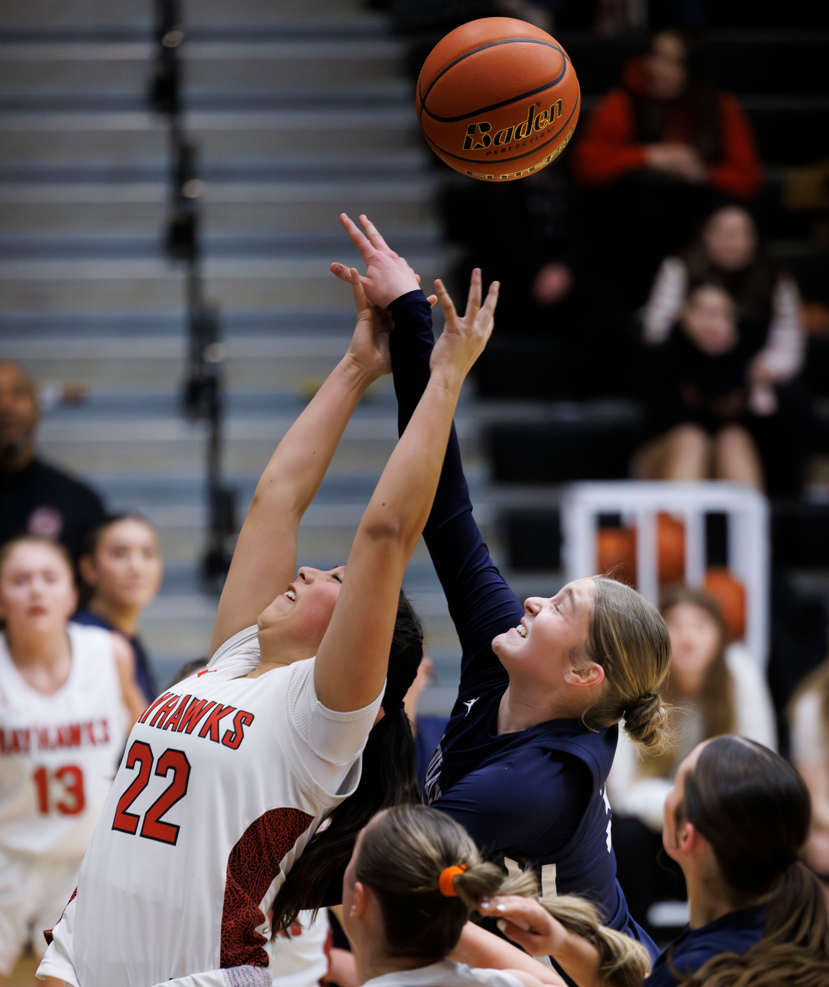 Bellingham’s Abigail Morrell and Squalicum’s Addison Kettman reach for a rebound.