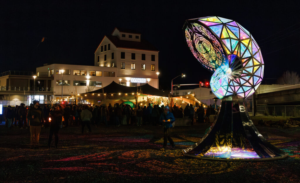 An art piece glows in the night during during the Fire & Story Festival.