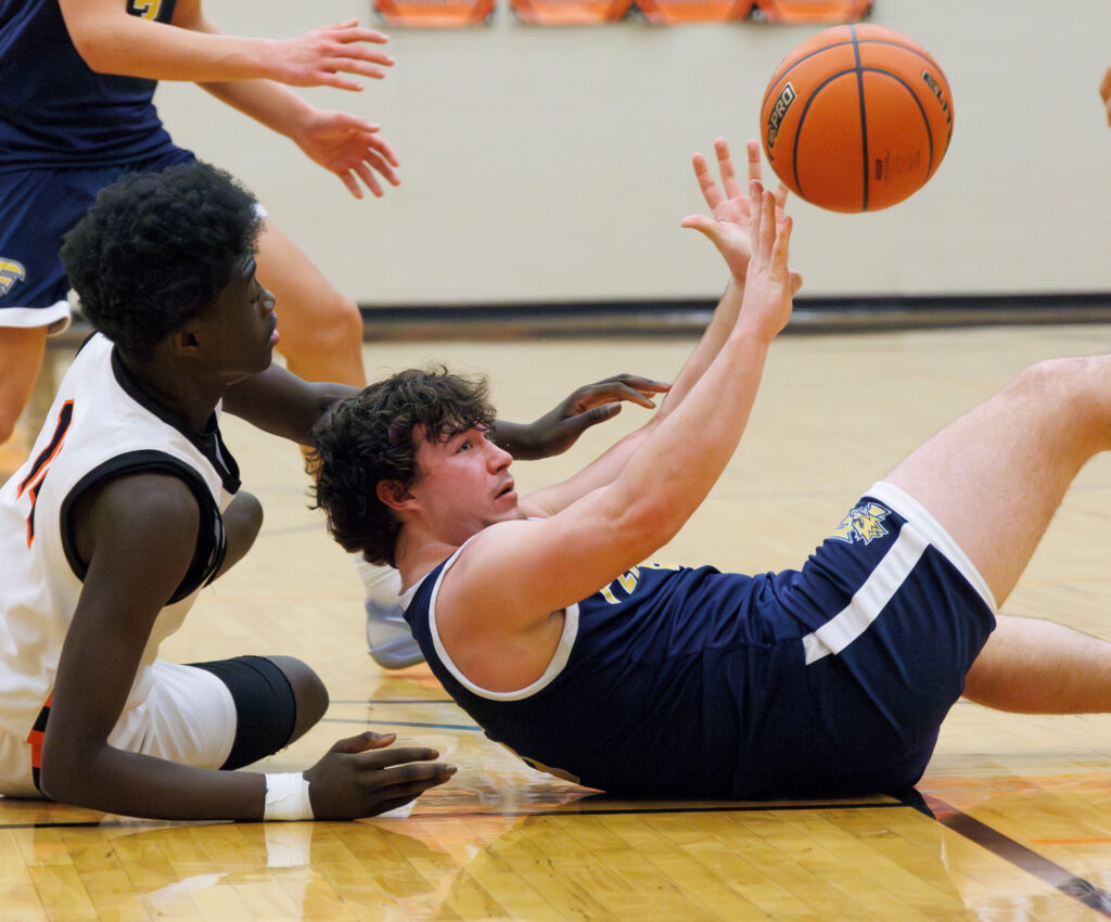 Ferndale’s Lincoln Thomas passes to a teammate after grabbing a loose ball.