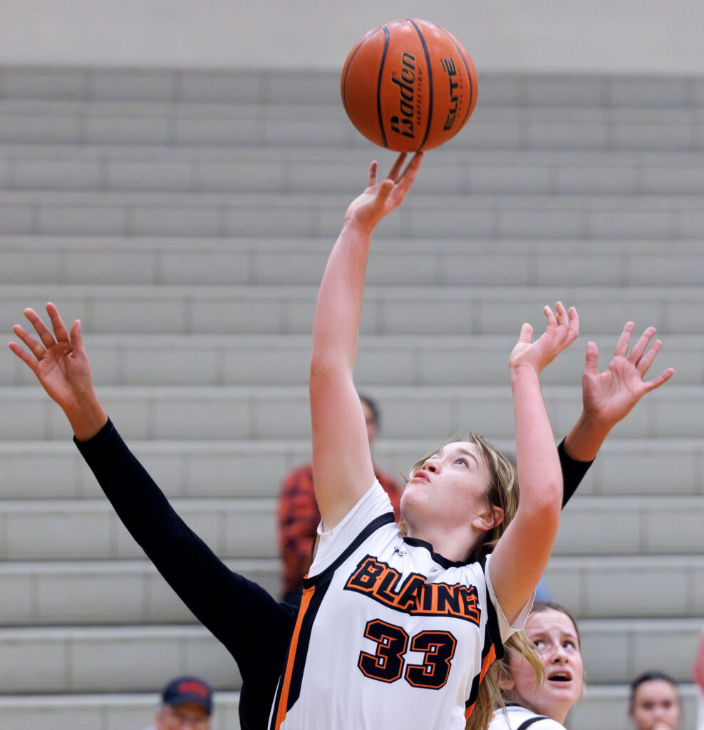 Blaine’s Brie Smith makes a shot near the hoop.