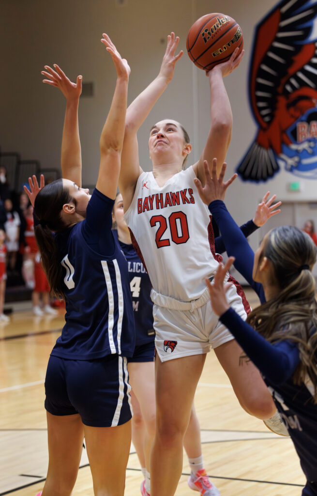 Bellingham’s Mary Lockett scores a basket early in the game against a double team.