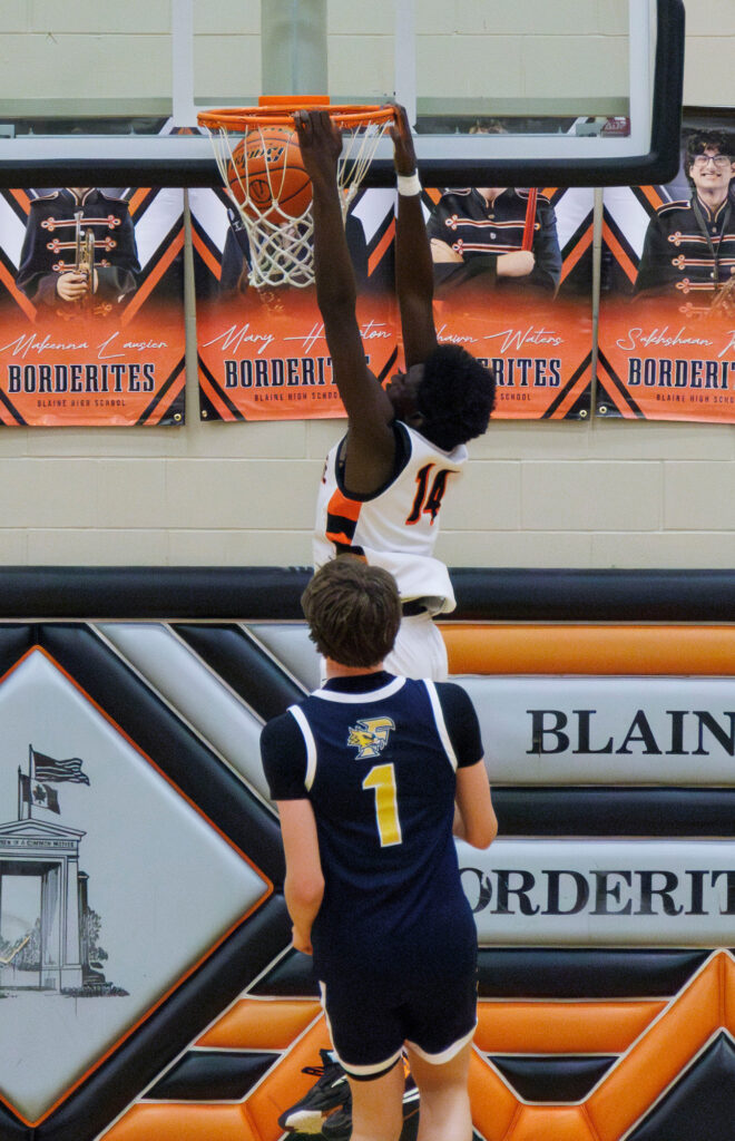 Blaine’s Dulio Kanagie throws down a slam dunk.