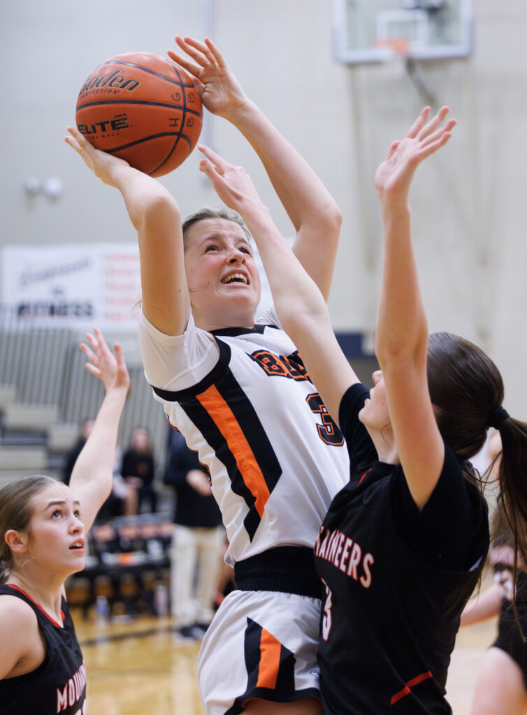 Blaine’s Kate Koreski drives and takes on a Mount Baker defender at the bucket.