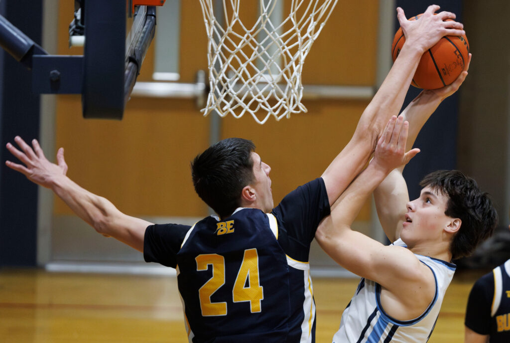 Lynden Christian’s Harvest Howell has his shot blocked by Burlington-Edison's Timophey Feskov.