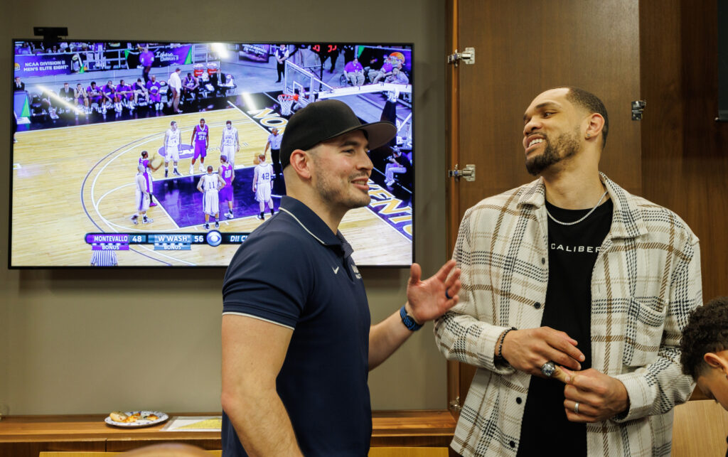 John Allen and Paul Jones chat as the 2012 championship game plays in the background.