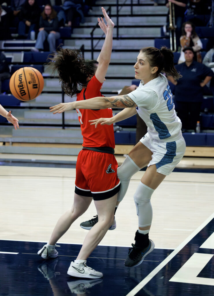 Western's Mason Oberg throws a pass as she goes out of bounds.