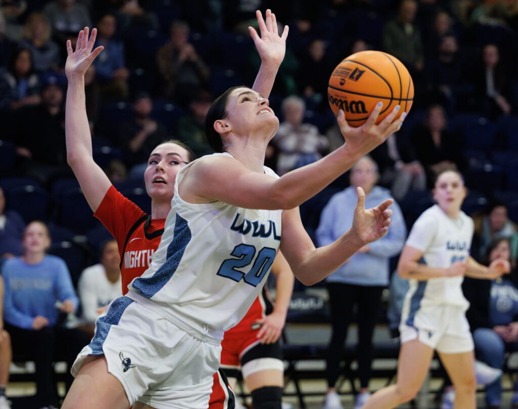 Western's Alyson Deaver goes under the net for the basket.