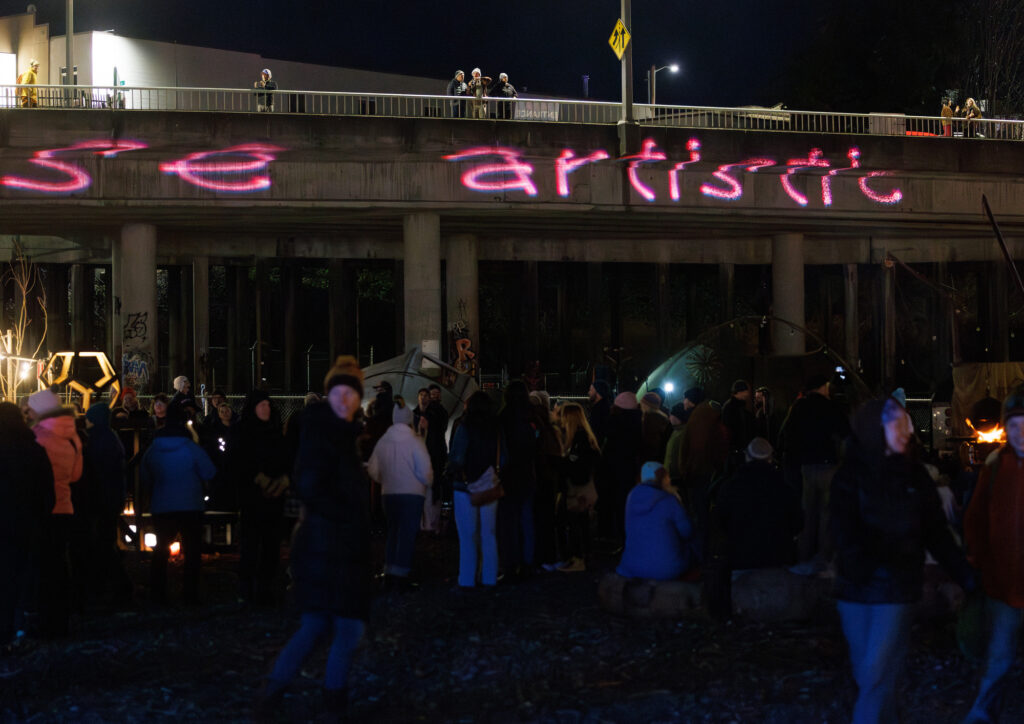 Words scroll along the bridge above the Fire & Story Festival.