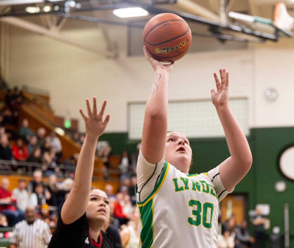 Lynden junior forward Payton Mills puts up a layup Feb. 19 during the Lions' 52-36 win over Archbishop Murphy in the 2A District 1 championship game at Mount Vernon High School. Mills led the Lions with 24 points and 12 rebounds.