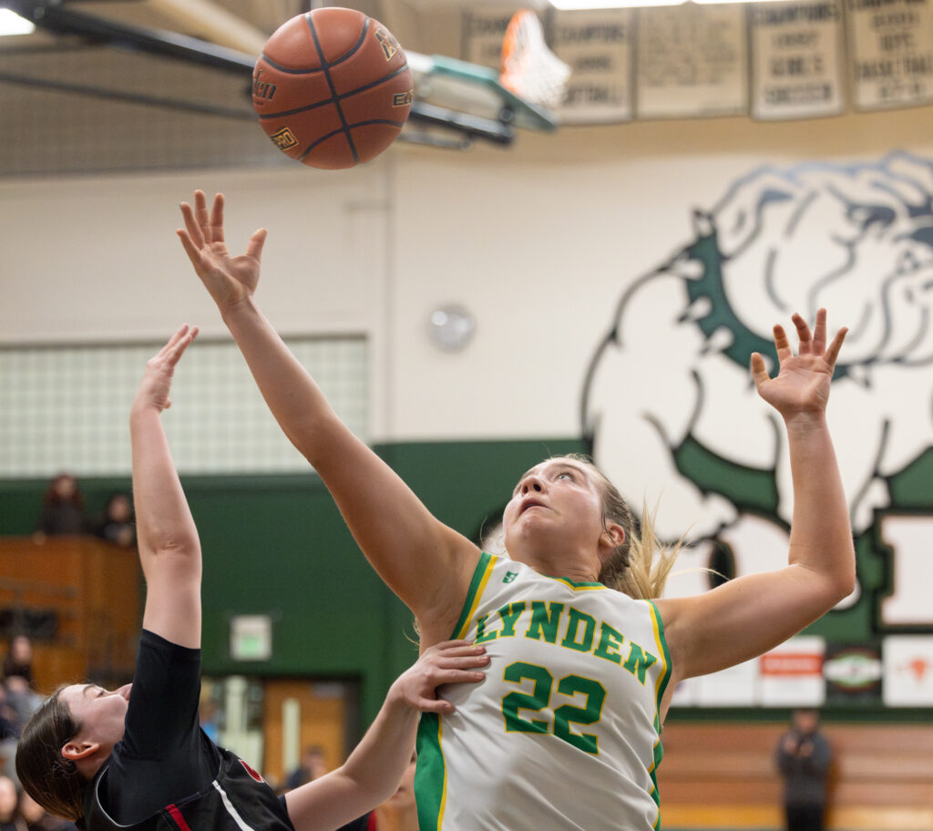 Lynden sophomore guard Finley Parcher reaches for a rebound.