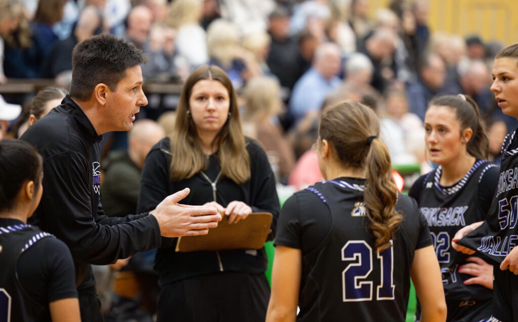 Nooksack Valley head coach Shane Wichers talks to the team during a timeout.