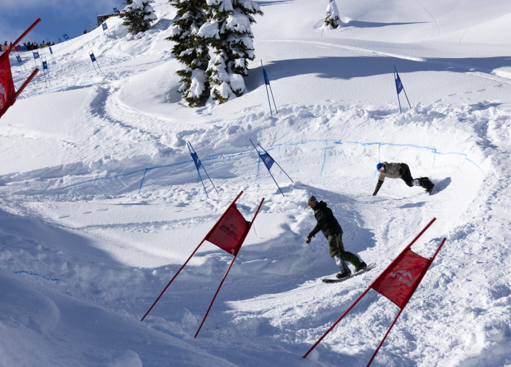 Devon Raney, who has vision loss, follows a guide while racing first in the slalom's Para division.