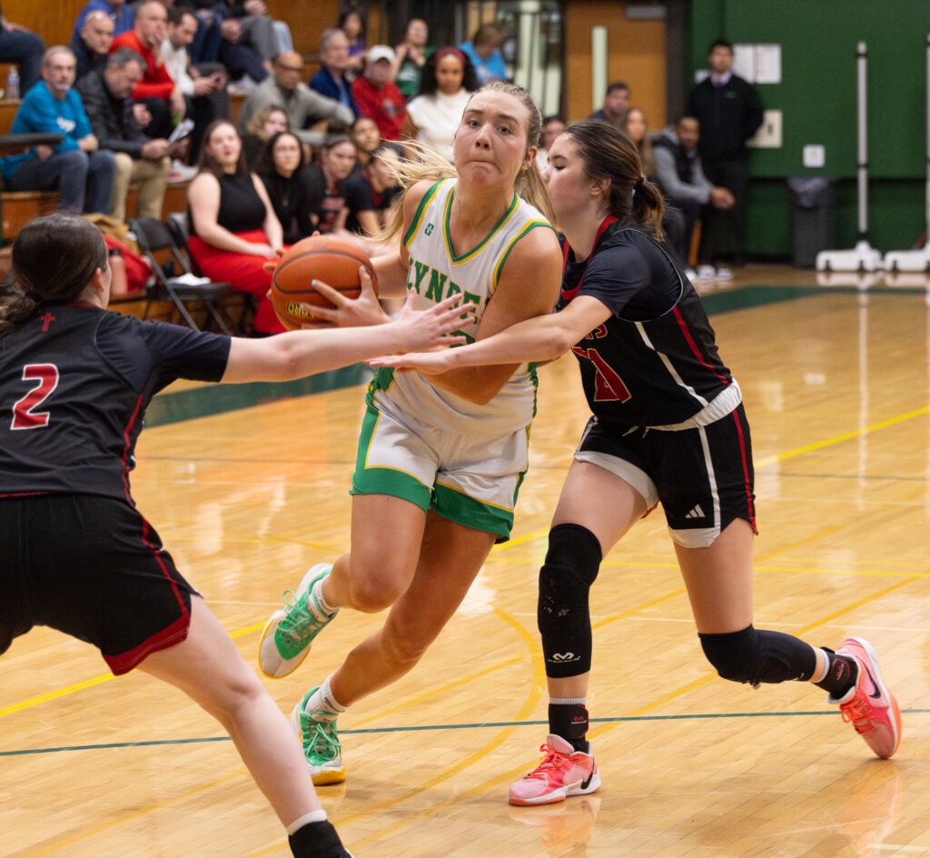 Lynden sophomore guard Finley Parcher steps through the contact of a defender on her way to the hoop.