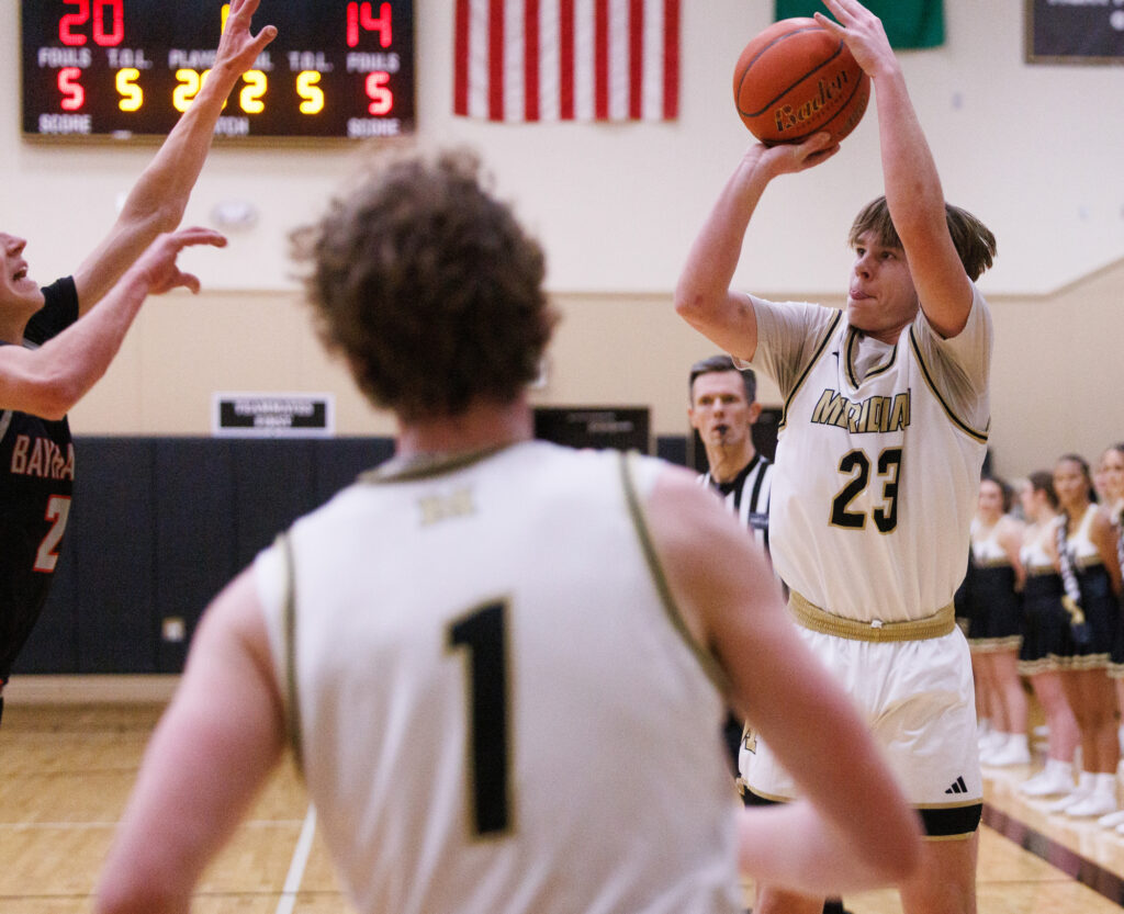 Meridian’s Pierce Brzozowski lines up a 3-pointer.