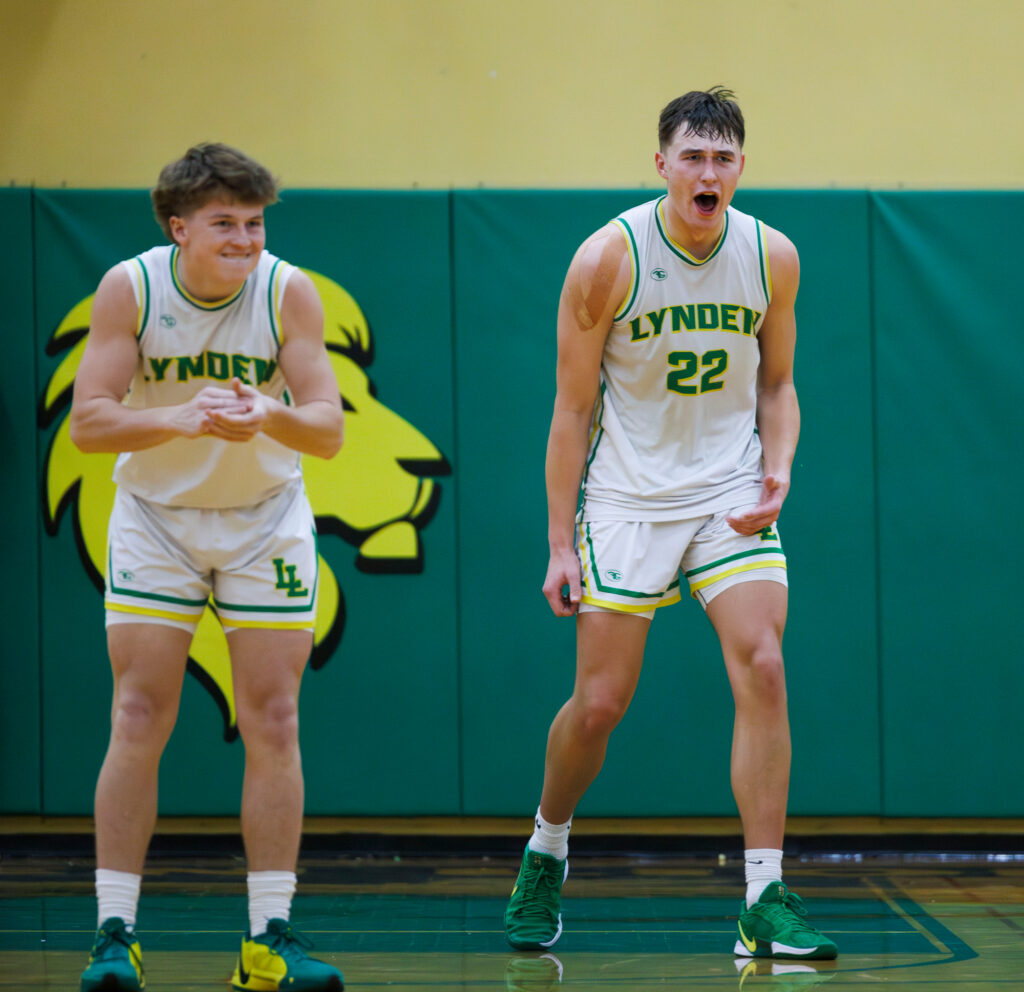 Lynden’s Gordy Bedlington and Brant Heppner celebrate as Lynden Christian calls for a timeout.