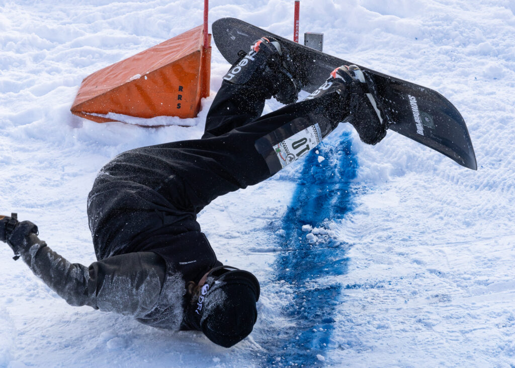 After crashing and stopping just feet short of the finish line, Shayne Pospisil somersaults across the line.