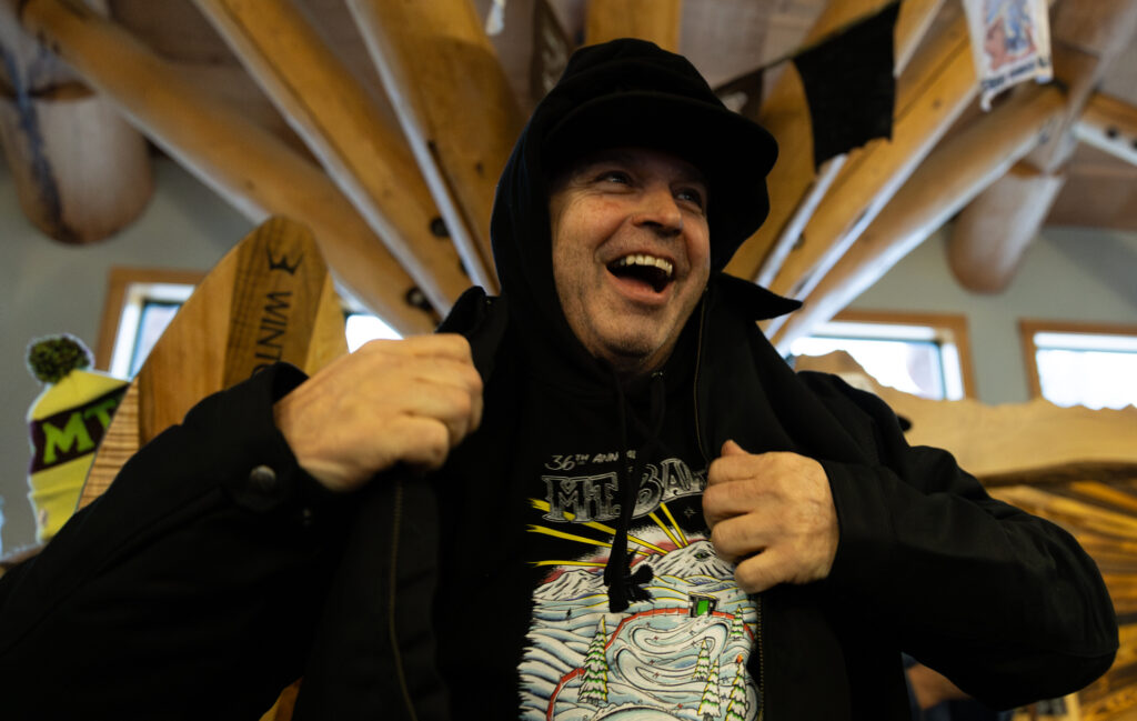 Douglas Gundlach smiles while receiving the LBS jacket after winning first in the Grand Masters Men division. Each division winner won a specialized jacket, a snowboard and a bag of gear.