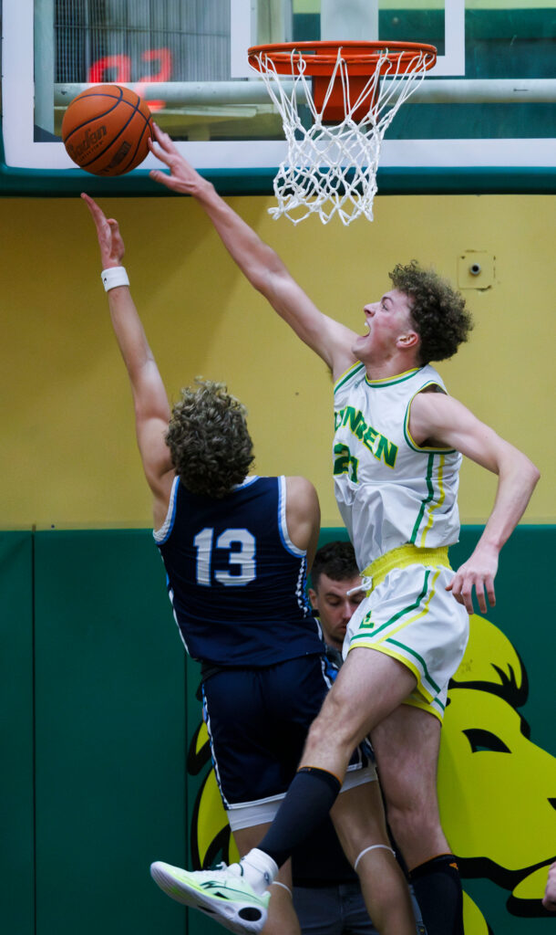 Lynden’s Jack Stapleton blocks a shot by Lynden Christian’s Gannon Dykstra.