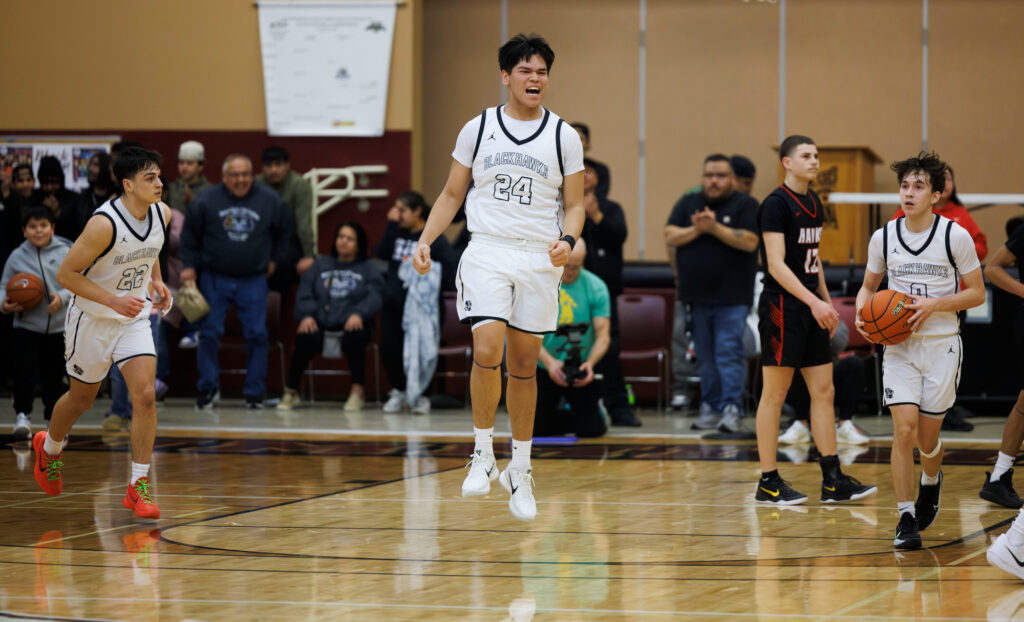 Lummi Nation’s Deandre James leaps in celebration as the Blackhawks beat Tulalip Heritage.