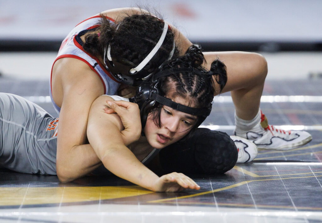 Blaine’s Makenna Lausier struggles against Granger’s Malia Riojas in her championship match. Lausier lost by pin.