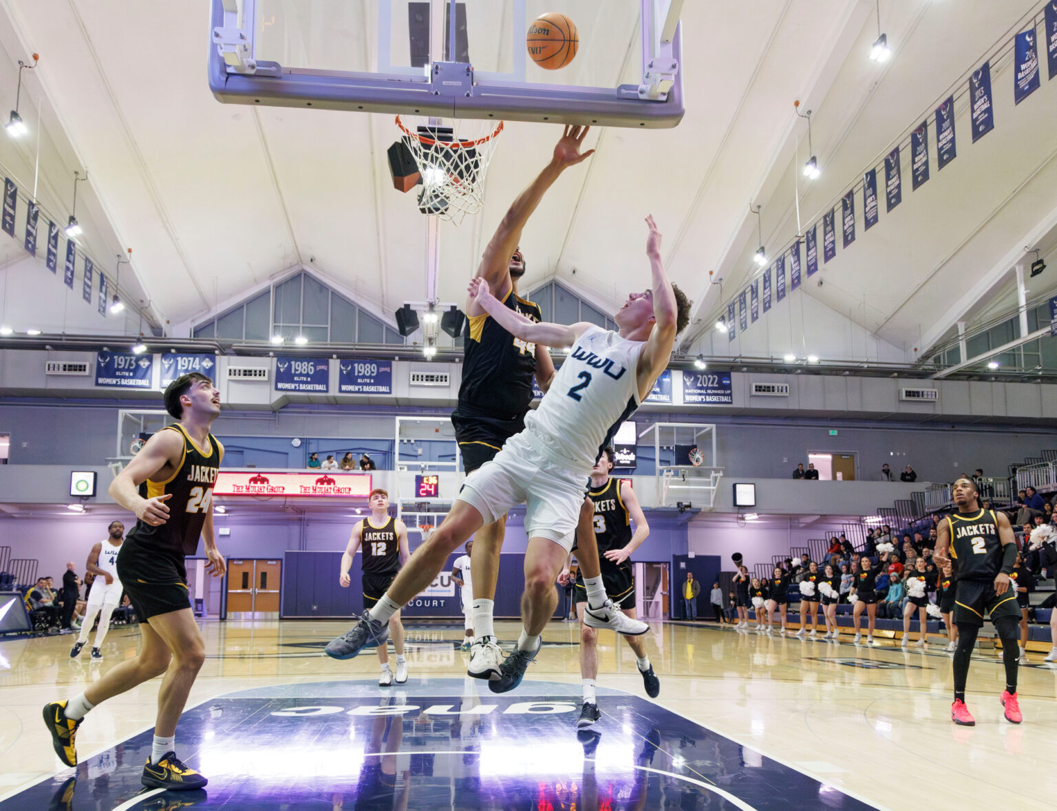 Western's Grant Kepley gets a basket and the foul as he gets knocked to the floor.