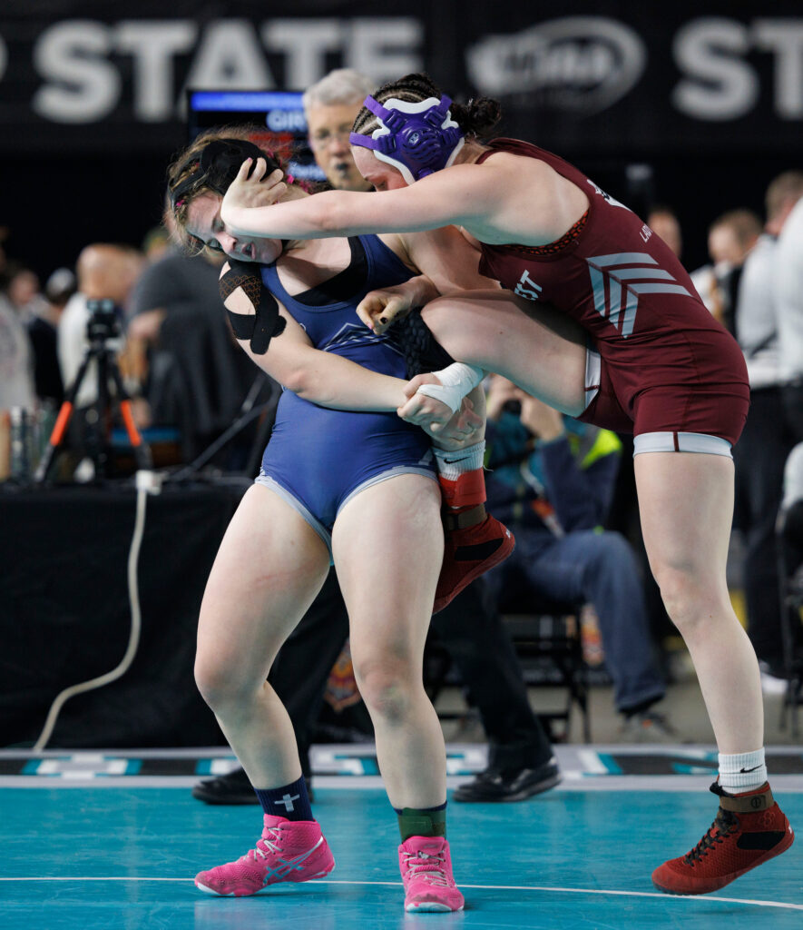 Squalicum’s Claire Hume tries for a takedown of W.F. West's Kaylee Lehman in the 130-pound final.