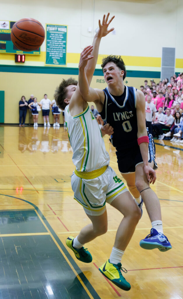 Lynden Christian’s Dawson Hintz throws an underhanded shot at the basket.