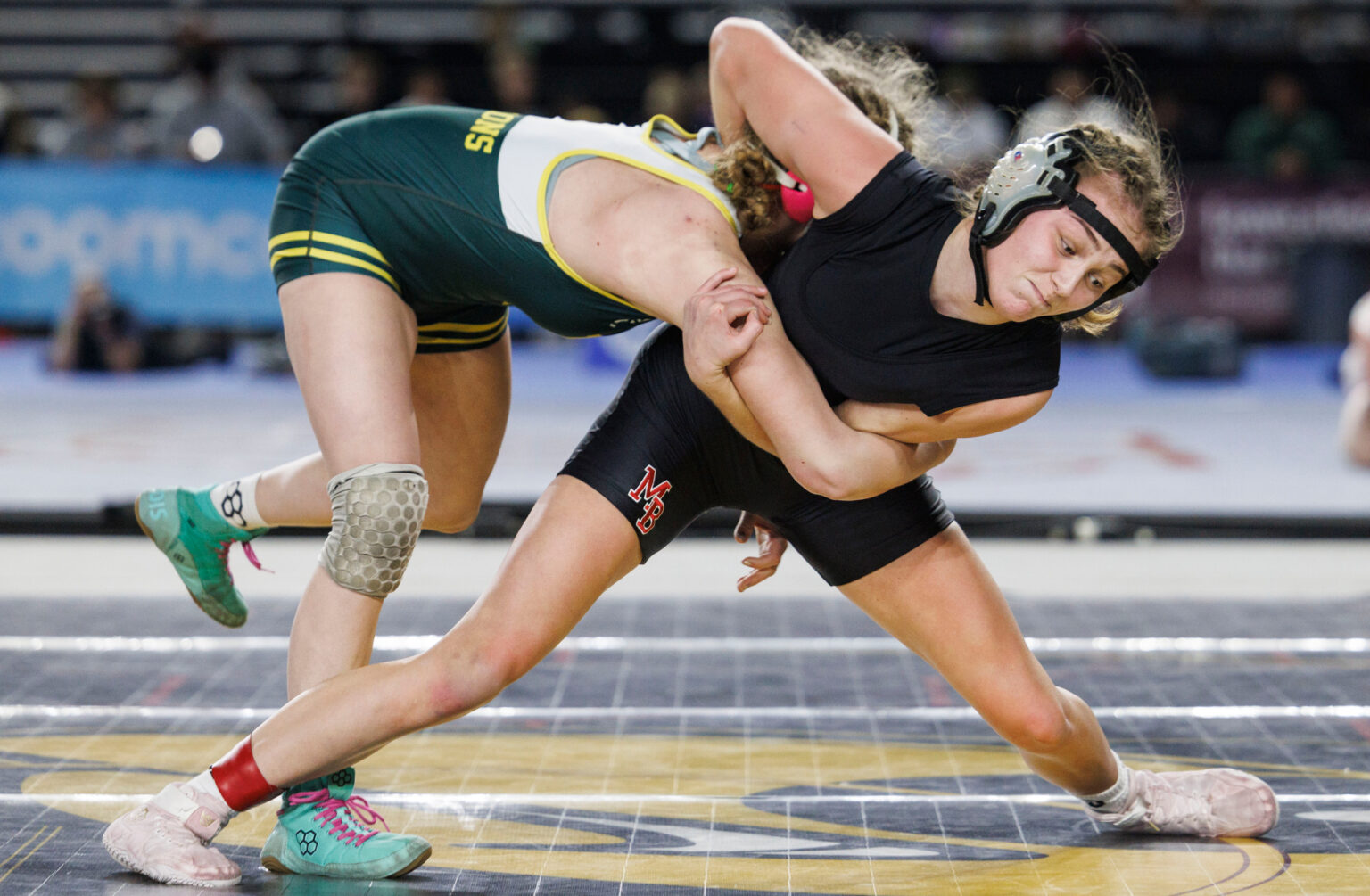 Mount Baker’s Tyla Olson tries to throw Liberty Bell’s Cassidy Jones-Mowen to the mat in the140-pound final. Olson lost to Jones-Mowen.