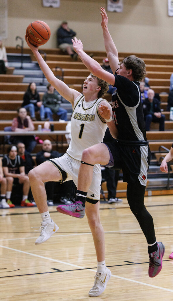 Meridian’s Talon Jenkins drives for a layup.