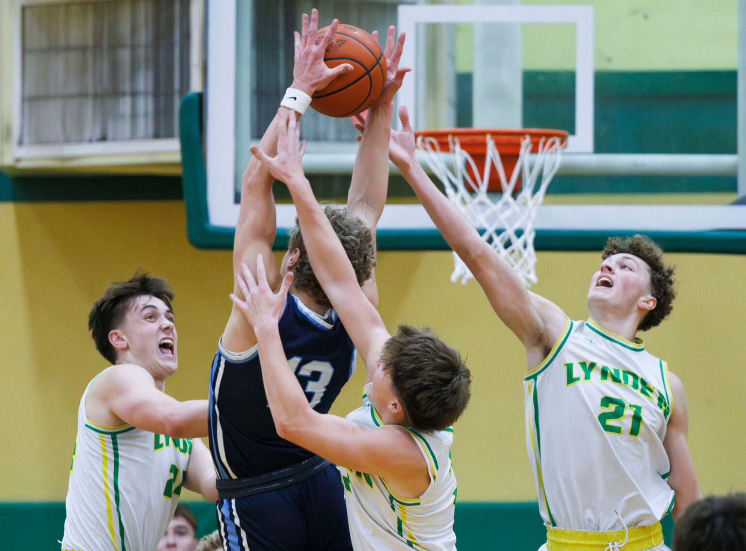 Lynden and Lynden Christian players leap for a rebound.