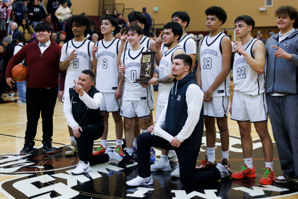 The Lummi Nation Blackhawks celebrate with the 1B District 1 trophy.