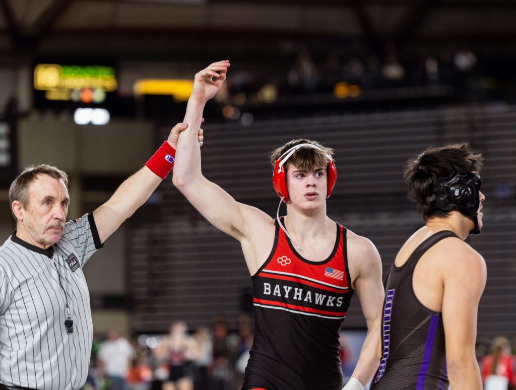 Bellingham’s Conor Rodriguez Stiff has his hand raised after a fall victory over Foster’s Joey Marshall in a 2A boys 150-pound match.