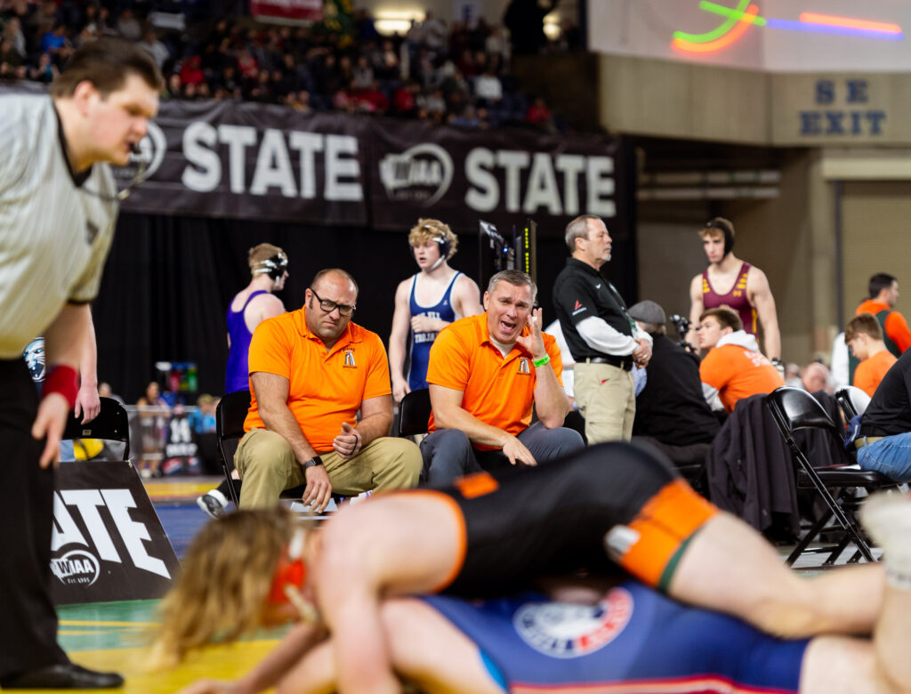 Blaine coaches shout instruction to Rhys Milligan in a 1A boys 175-pound match.