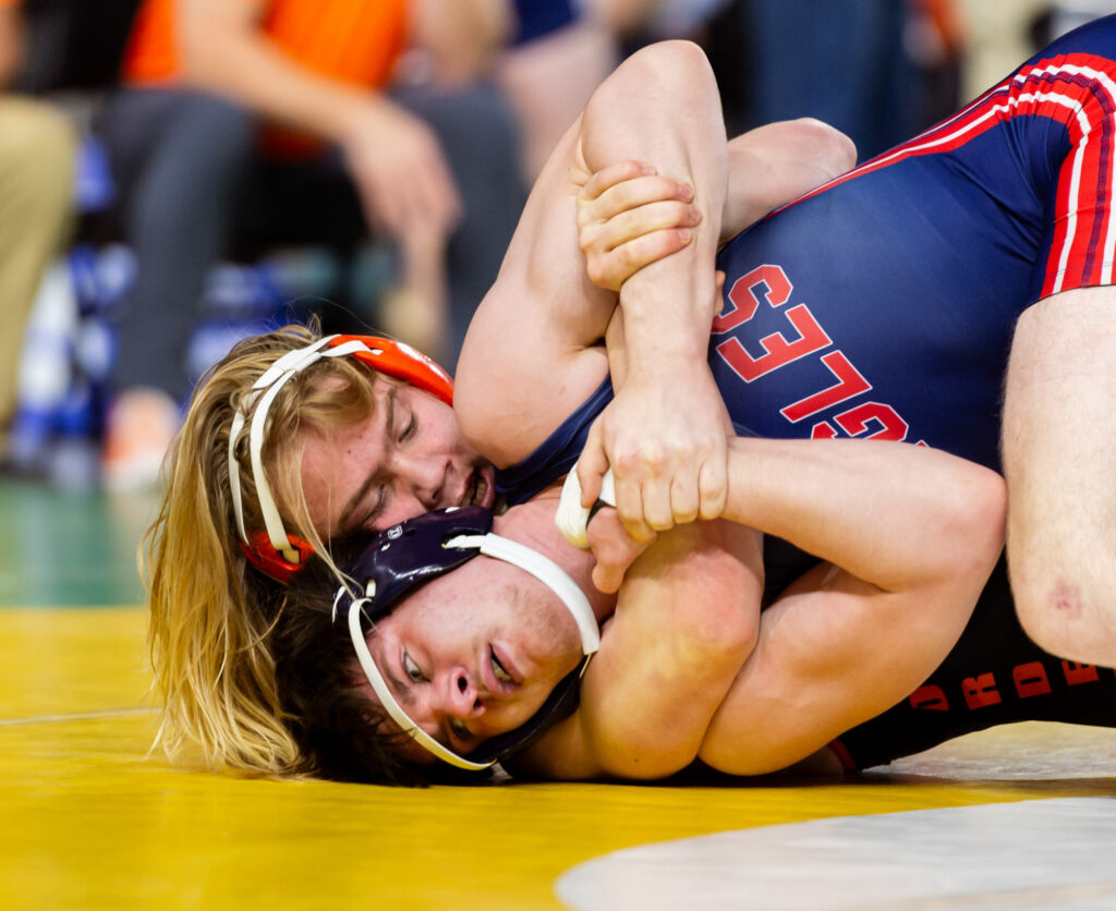 Blaine’s Rhys Milligan puts Life Christian’s Jordan Harp in a headlock in a 1A boys 175-pound match.