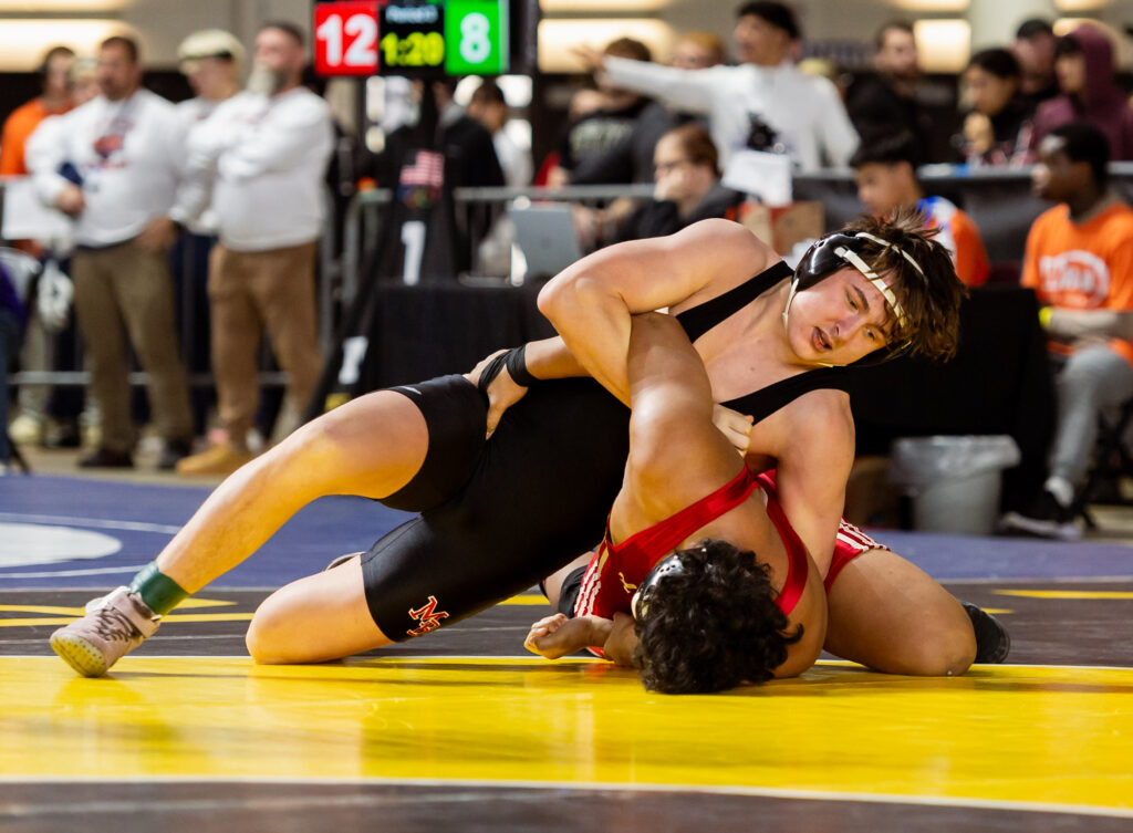 Mount Baker’s Dylan Moa tries to turn Fort Vancouver’s Geziah Biou in a 1A boys 190-pound match.