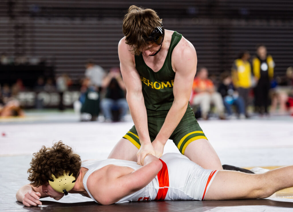 Sehome’s Grant Oliver works an arm bar against Orting’s Wyatt Rodarte in a 2A boys 165-pound match.