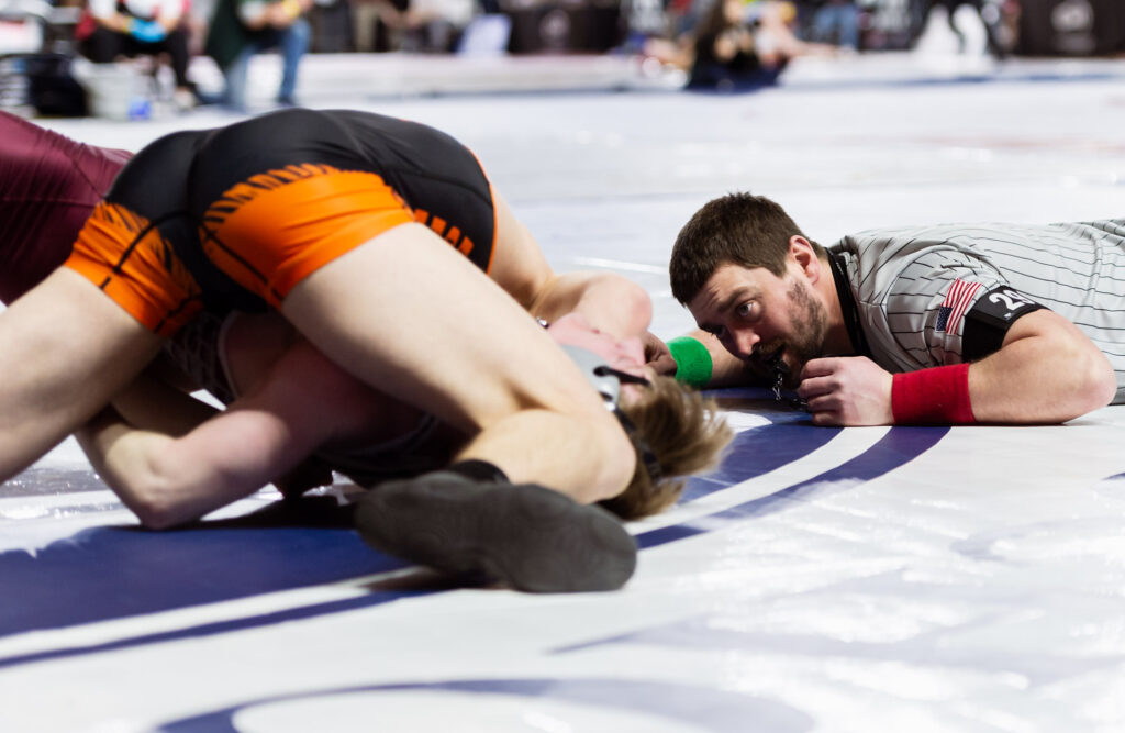 The referee looks for the pin as Blaine’s Daniel Johner defeats Montesano’s Alex Salstrom by technical fall in a 1A boys 132-pound match.