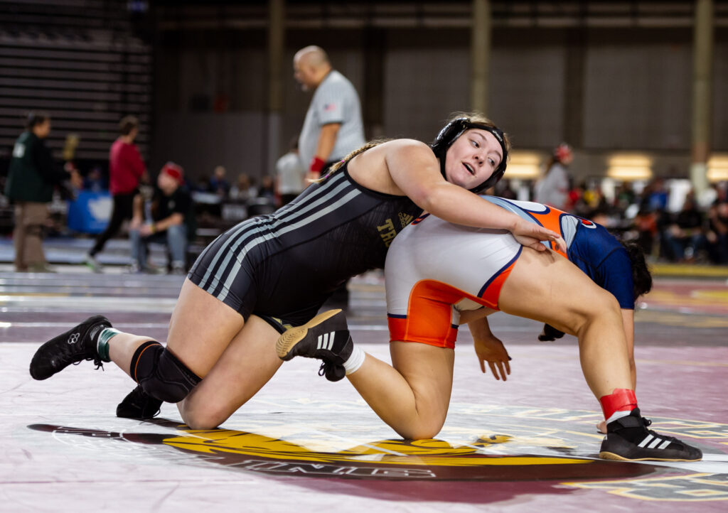 Meridian’s Kennedy Farrar takes down College Place’s Maria Aguilera in a 1A girls 170-pound match.