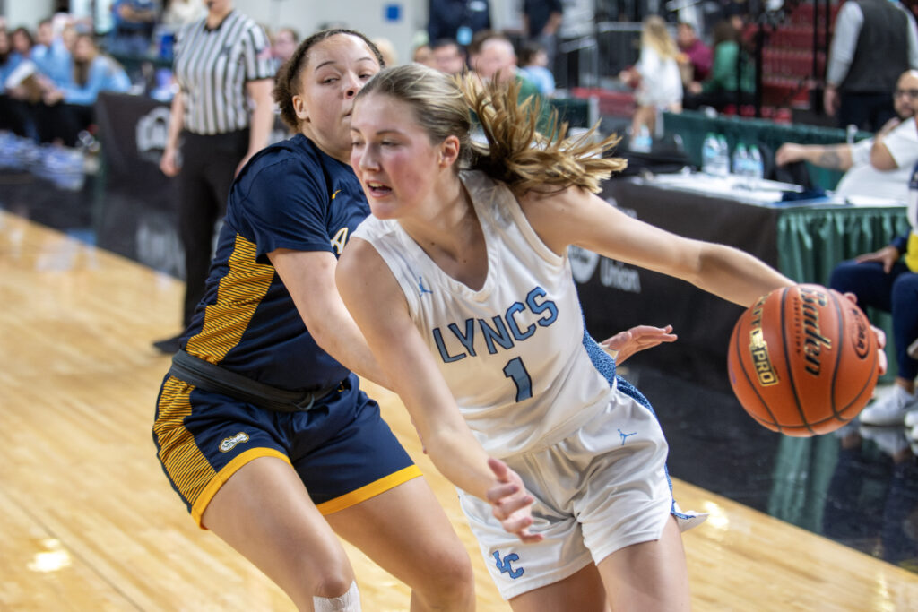 Lynden Christian senior Danya Dykstra drives past an Annie Wright defender at the baseline.